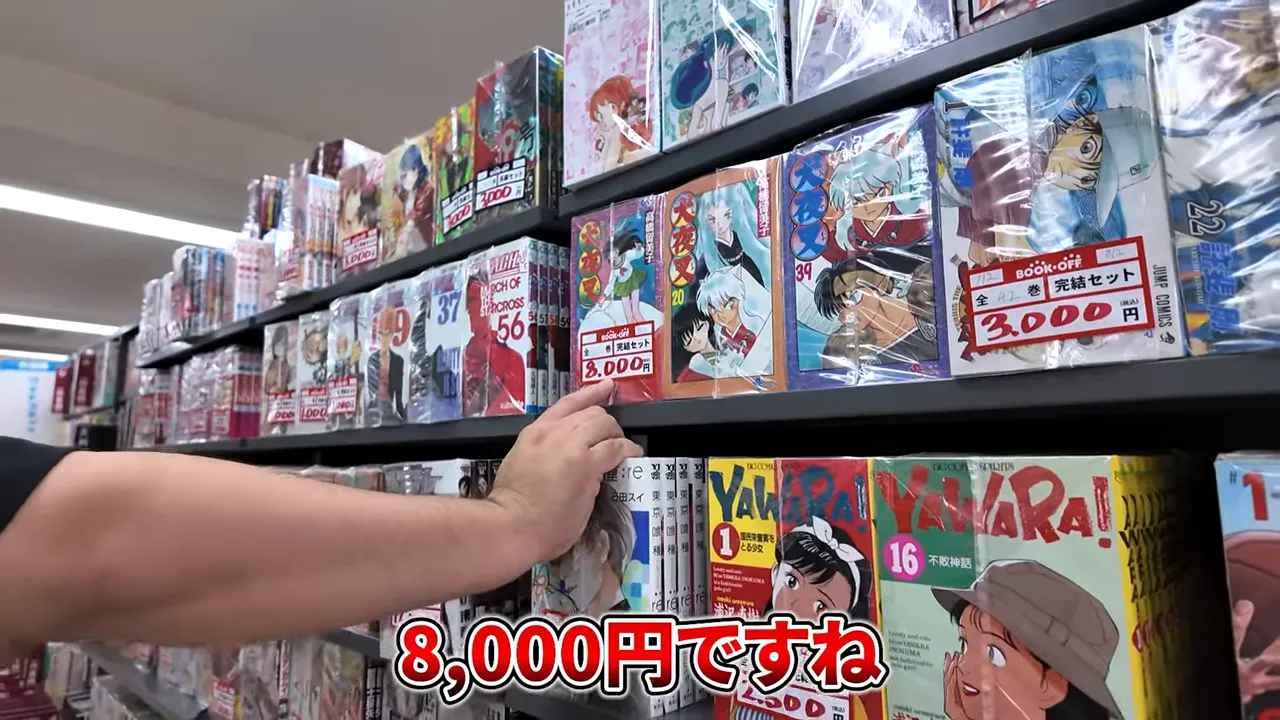 セット本コーナー、価格をチェックしている様子